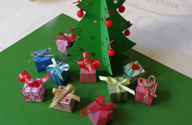 Miniature gifts for our christmas tree on cardboard