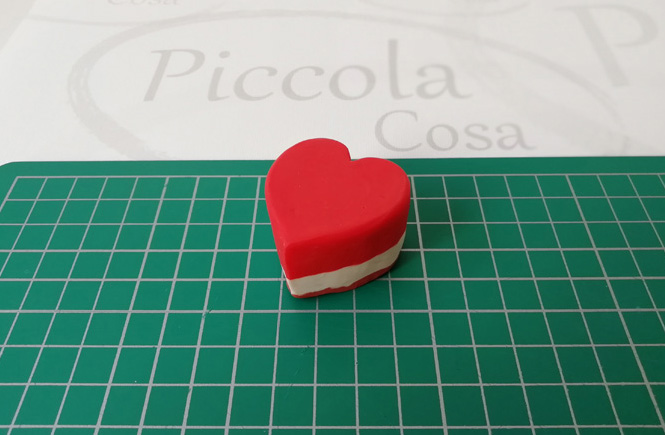 Heart cake after cut with trace paper.